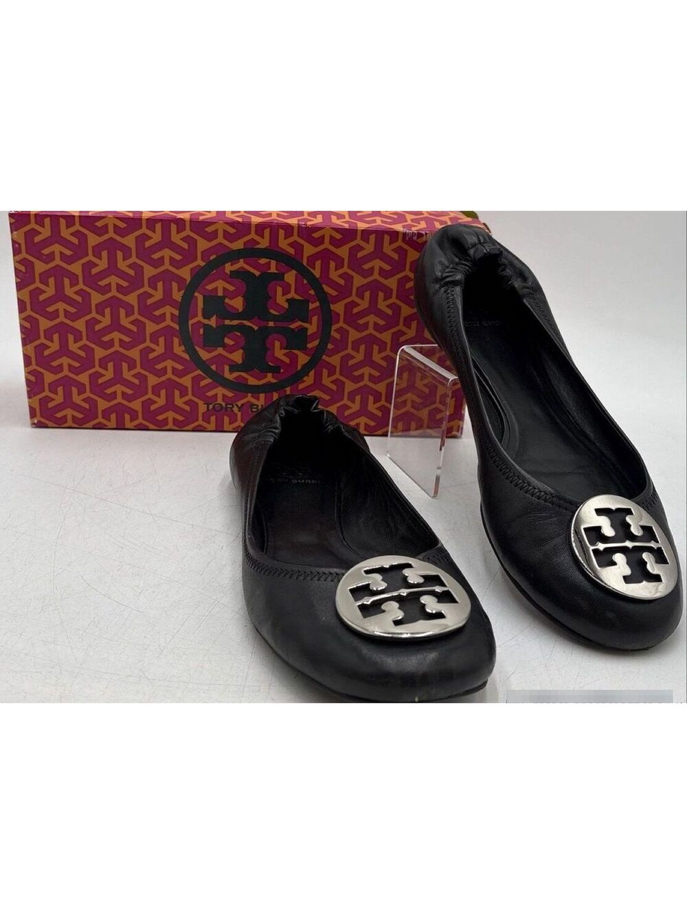 Tory Burch black leather ballet flats with silver logo medallion